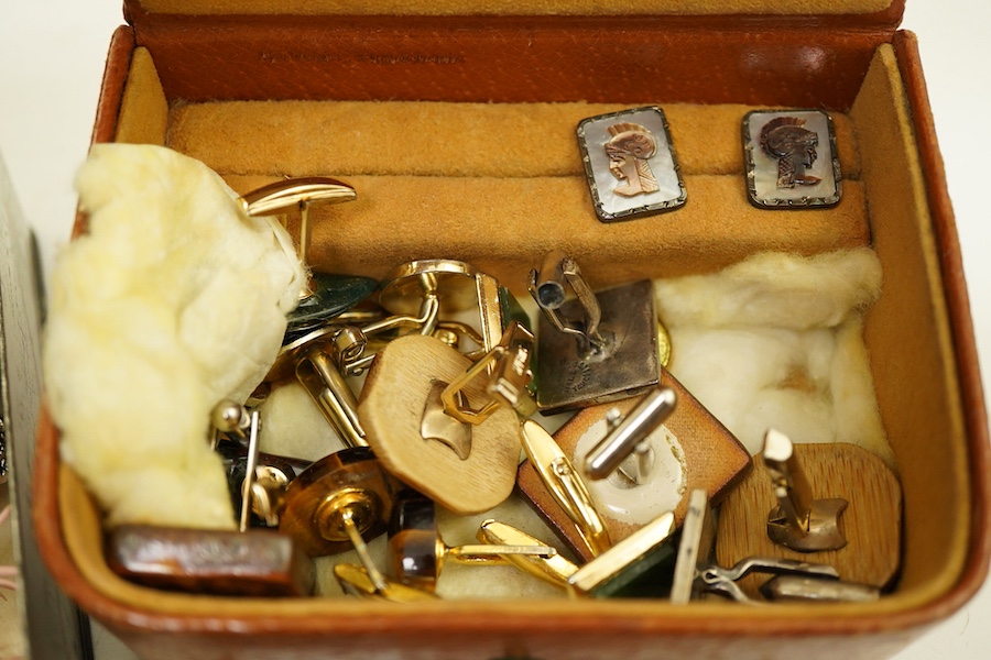A small collection of costume jewellery, a Christian Dior golf club tie clip, a pair of simulated pearl screwback earrings, stamped 9ct, an Indian silver locket, assorted cufflinks etc
